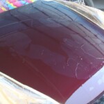 Before and after photographs of a damaged Porsche that was repaired by Elite Paint & Body Shop in West Palm Beach, Florida.